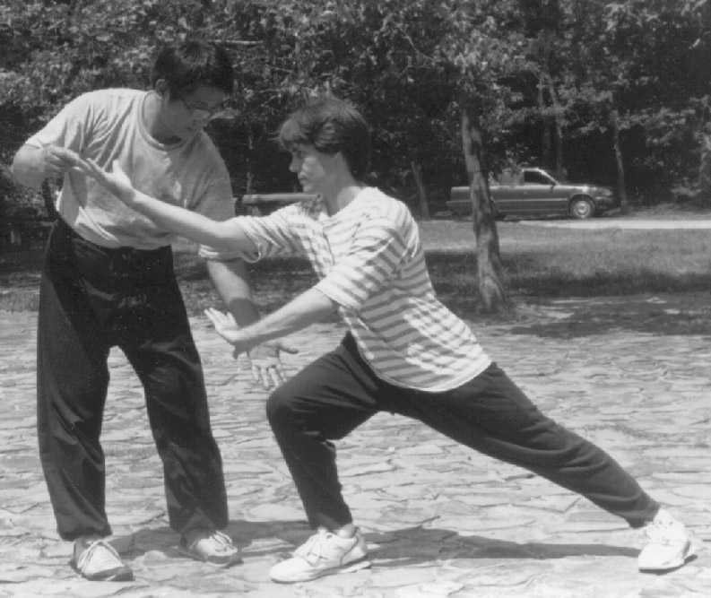Luo Dexiu adjusting a Post-Heaven posture for student Tim Cartmell